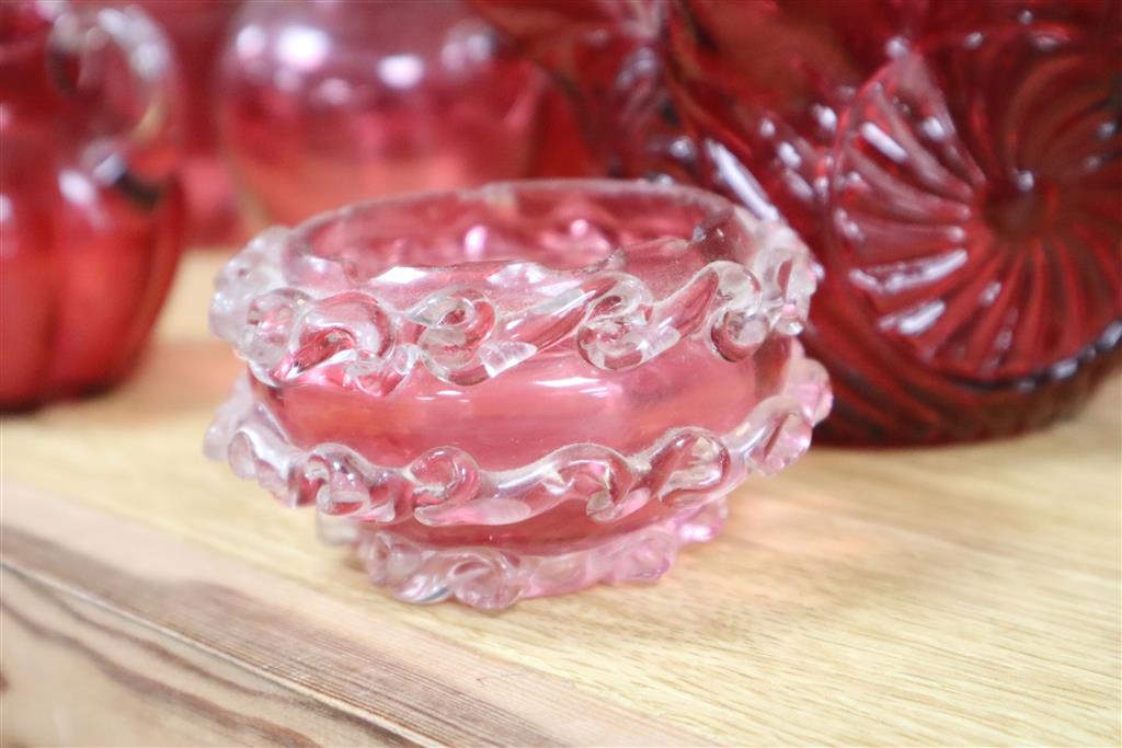 A collection of Victorian and later cranberry and ruby coloured glassware, ewer 18cm